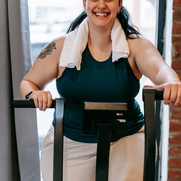 Smiling person feeling energetic and positive after a workout session.